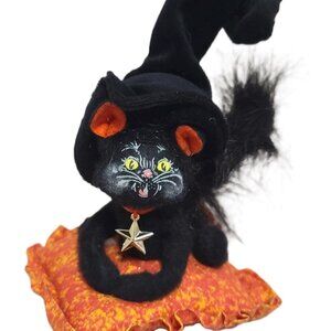 Annalee Halloween black cat sitting on an orange blanket